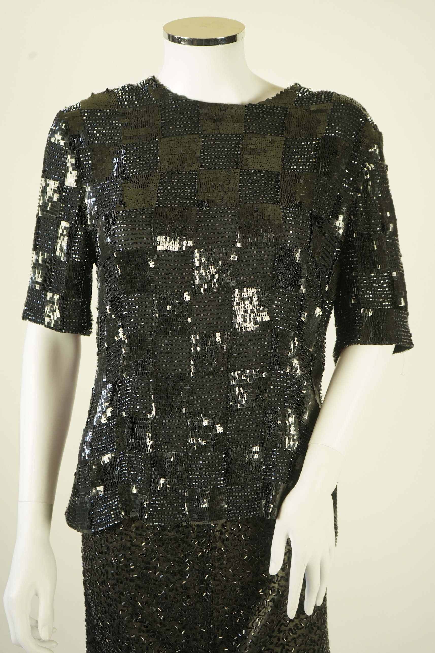 A lady's Jaeger black sequin skirt and black sequin top (not matching). Size UK 12-14